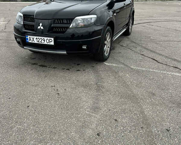 Чорний Міцубісі Аутлендер, об'ємом двигуна 2.38 л та пробігом 190 тис. км за 6800 $, фото 4 на Automoto.ua