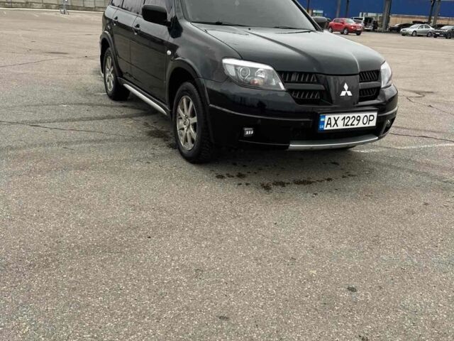 Черный Мицубиси Аутлендер, объемом двигателя 2.4 л и пробегом 190 тыс. км за 6800 $, фото 1 на Automoto.ua