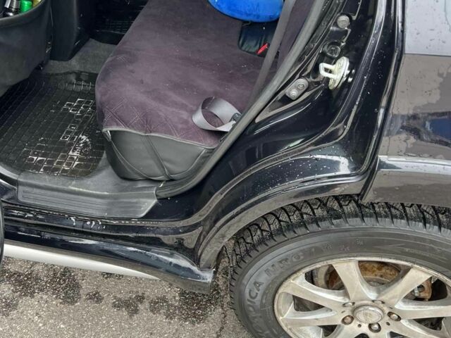 Черный Мицубиси Аутлендер, объемом двигателя 2.4 л и пробегом 190 тыс. км за 6800 $, фото 13 на Automoto.ua