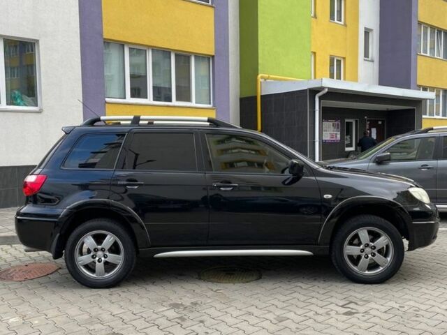 Черный Мицубиси Аутлендер, объемом двигателя 2.38 л и пробегом 270 тыс. км за 5900 $, фото 2 на Automoto.ua