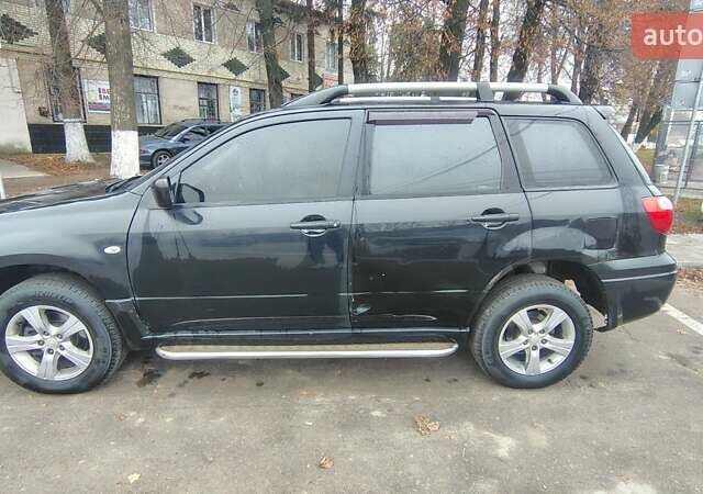 Черный Мицубиси Аутлендер, объемом двигателя 2 л и пробегом 330 тыс. км за 4997 $, фото 7 на Automoto.ua