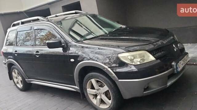 Черный Мицубиси Аутлендер, объемом двигателя 2 л и пробегом 380 тыс. км за 5000 $, фото 6 на Automoto.ua