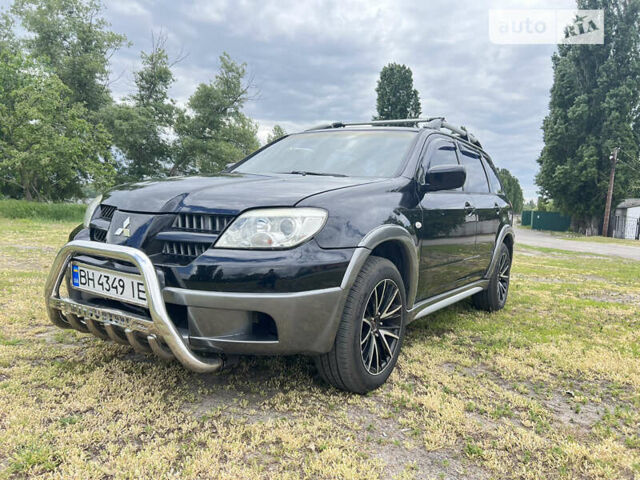 Чорний Міцубісі Аутлендер, об'ємом двигуна 2.38 л та пробігом 340 тис. км за 6299 $, фото 15 на Automoto.ua