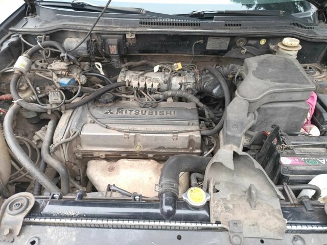 Черный Мицубиси Аутлендер, объемом двигателя 2 л и пробегом 495 тыс. км за 4400 $, фото 1 на Automoto.ua