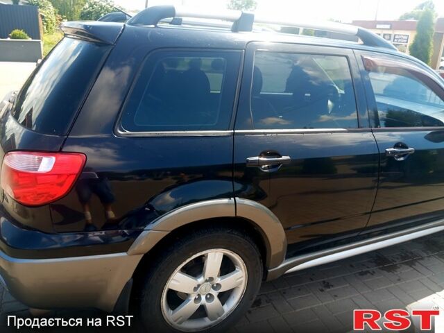 Черный Мицубиси Аутлендер, объемом двигателя 2.4 л и пробегом 270 тыс. км за 7800 $, фото 4 на Automoto.ua