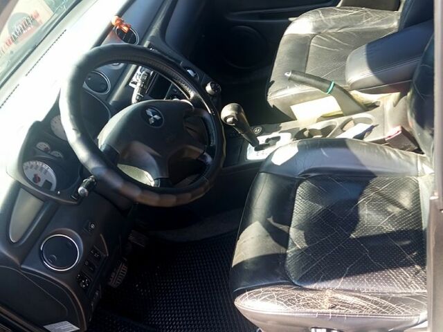 Черный Мицубиси Аутлендер, объемом двигателя 2.4 л и пробегом 270 тыс. км за 7800 $, фото 9 на Automoto.ua