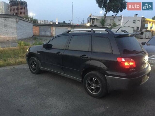 Чорний Міцубісі Аутлендер, об'ємом двигуна 2 л та пробігом 310 тис. км за 6500 $, фото 6 на Automoto.ua