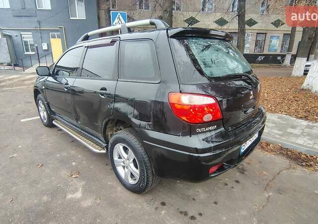 Черный Мицубиси Аутлендер, объемом двигателя 2 л и пробегом 330 тыс. км за 4997 $, фото 5 на Automoto.ua