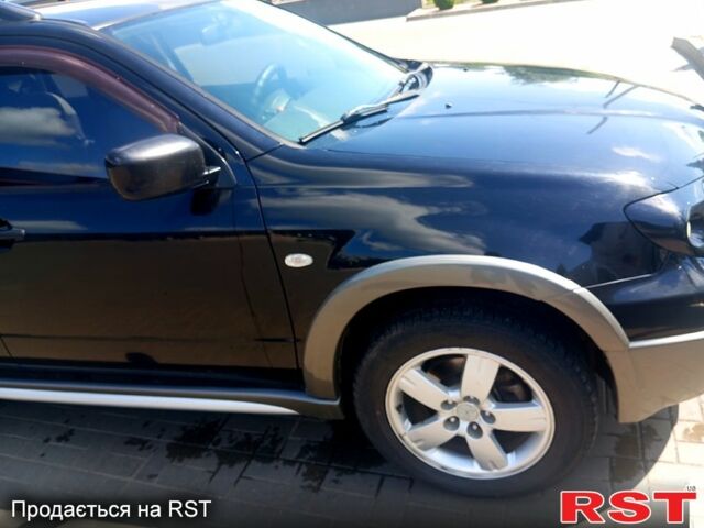 Черный Мицубиси Аутлендер, объемом двигателя 2.4 л и пробегом 270 тыс. км за 7800 $, фото 3 на Automoto.ua