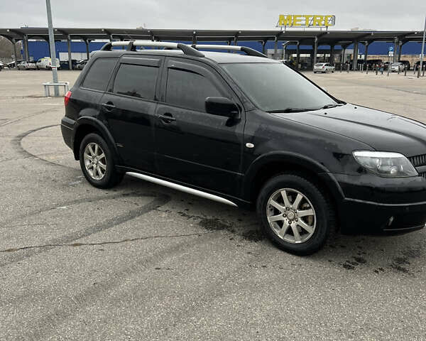 Чорний Міцубісі Аутлендер, об'ємом двигуна 2.38 л та пробігом 190 тис. км за 6800 $, фото 3 на Automoto.ua