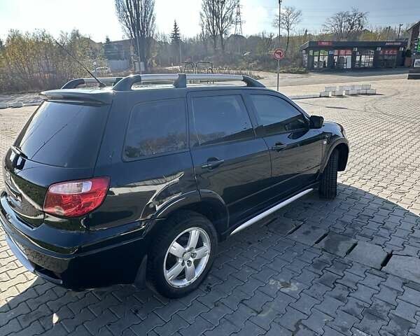 Черный Мицубиси Аутлендер, объемом двигателя 2.4 л и пробегом 307 тыс. км за 5600 $, фото 5 на Automoto.ua