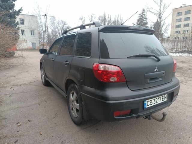 Черный Мицубиси Аутлендер, объемом двигателя 2 л и пробегом 495 тыс. км за 4400 $, фото 5 на Automoto.ua