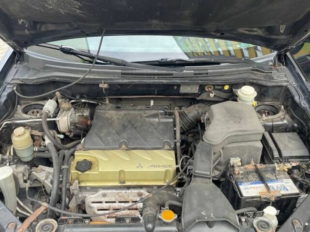 Черный Мицубиси Аутлендер, объемом двигателя 2.38 л и пробегом 270 тыс. км за 5900 $, фото 7 на Automoto.ua