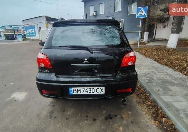Черный Мицубиси Аутлендер, объемом двигателя 2 л и пробегом 330 тыс. км за 4997 $, фото 4 на Automoto.ua