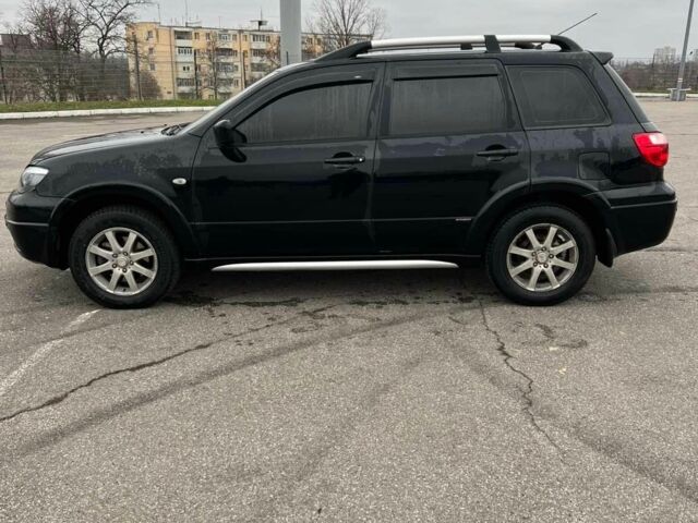Черный Мицубиси Аутлендер, объемом двигателя 2.4 л и пробегом 190 тыс. км за 6800 $, фото 4 на Automoto.ua