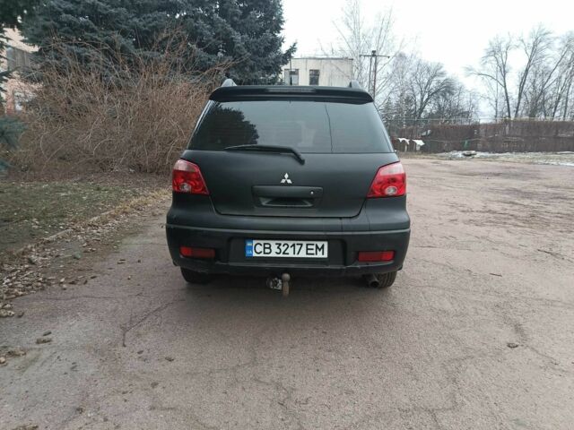 Черный Мицубиси Аутлендер, объемом двигателя 2 л и пробегом 495 тыс. км за 4400 $, фото 6 на Automoto.ua