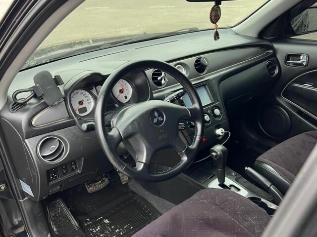 Черный Мицубиси Аутлендер, объемом двигателя 2.4 л и пробегом 190 тыс. км за 6800 $, фото 11 на Automoto.ua