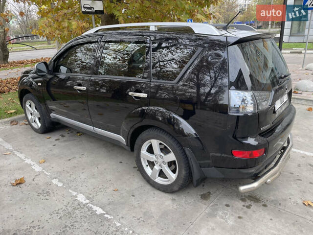 Черный Мицубиси Аутлендер, объемом двигателя 2.4 л и пробегом 300 тыс. км за 8500 $, фото 4 на Automoto.ua