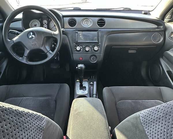 Черный Мицубиси Аутлендер, объемом двигателя 2.4 л и пробегом 307 тыс. км за 5600 $, фото 18 на Automoto.ua