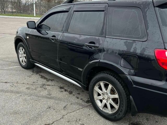 Черный Мицубиси Аутлендер, объемом двигателя 2.4 л и пробегом 190 тыс. км за 6800 $, фото 9 на Automoto.ua