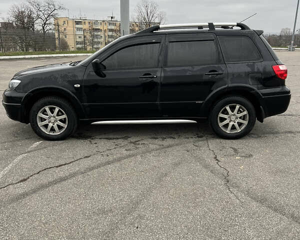 Чорний Міцубісі Аутлендер, об'ємом двигуна 2.38 л та пробігом 190 тис. км за 6800 $, фото 10 на Automoto.ua