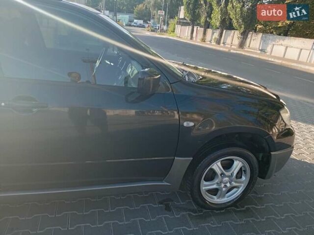 Черный Мицубиси Аутлендер, объемом двигателя 2 л и пробегом 274 тыс. км за 5300 $, фото 27 на Automoto.ua