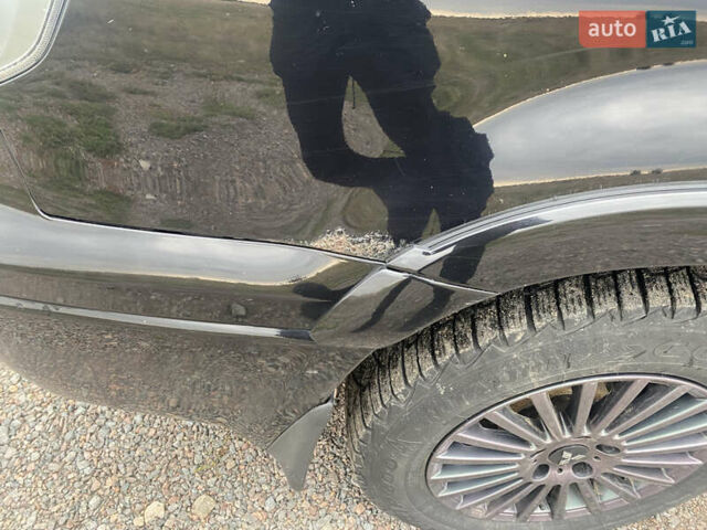 Черный Мицубиси Аутлендер, объемом двигателя 2 л и пробегом 270 тыс. км за 5700 $, фото 4 на Automoto.ua