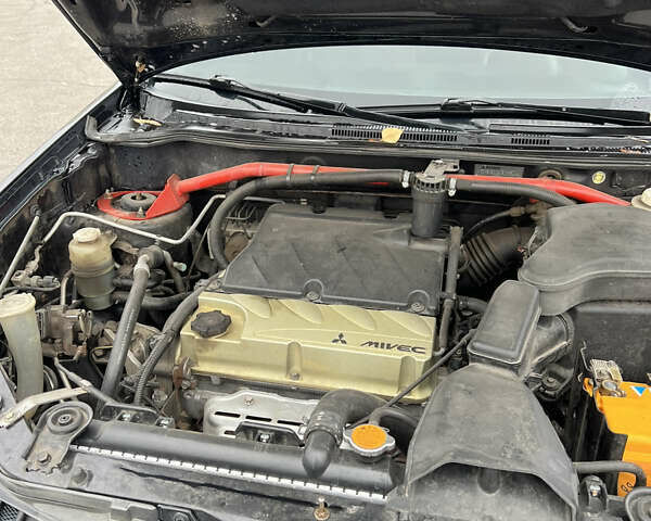 Чорний Міцубісі Аутлендер, об'ємом двигуна 2.38 л та пробігом 190 тис. км за 6800 $, фото 18 на Automoto.ua