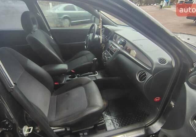 Черный Мицубиси Аутлендер, объемом двигателя 2 л и пробегом 330 тыс. км за 4997 $, фото 12 на Automoto.ua