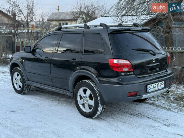 Чорний Міцубісі Аутлендер, об'ємом двигуна 2 л та пробігом 210 тис. км за 4499 $, фото 6 на Automoto.ua