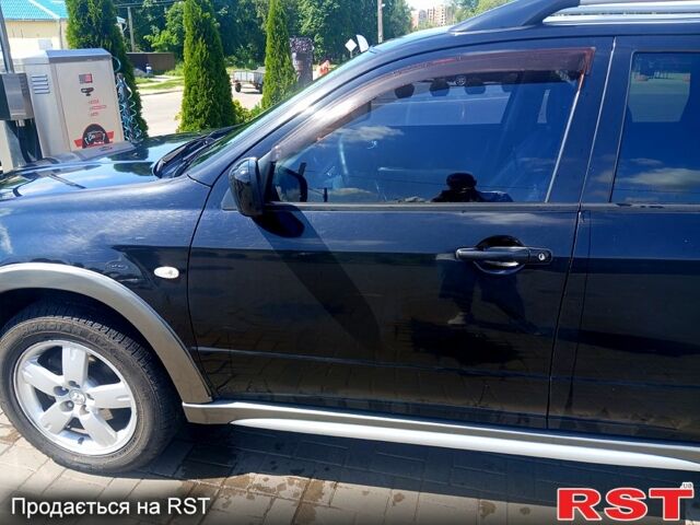 Черный Мицубиси Аутлендер, объемом двигателя 2.4 л и пробегом 270 тыс. км за 7800 $, фото 6 на Automoto.ua