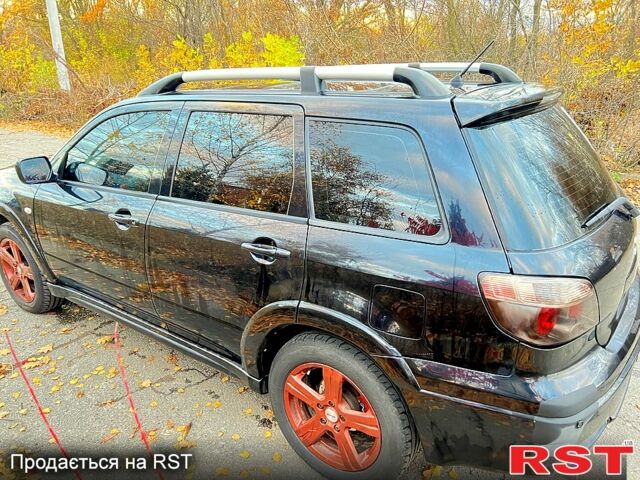 Чорний Міцубісі Аутлендер, об'ємом двигуна 2 л та пробігом 295 тис. км за 7500 $, фото 5 на Automoto.ua