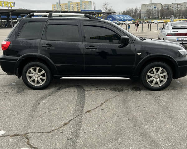 Чорний Міцубісі Аутлендер, об'ємом двигуна 2.38 л та пробігом 190 тис. км за 6800 $, фото 9 на Automoto.ua