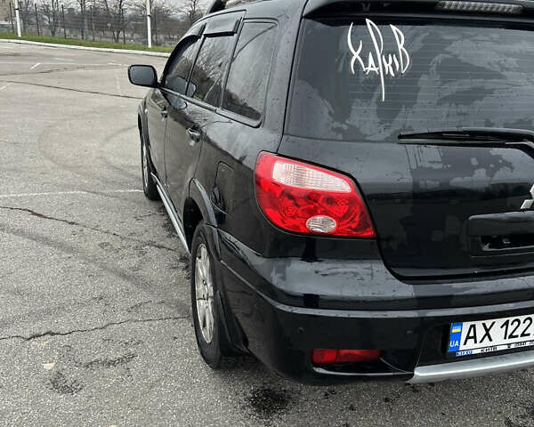 Чорний Міцубісі Аутлендер, об'ємом двигуна 2.38 л та пробігом 190 тис. км за 6800 $, фото 7 на Automoto.ua