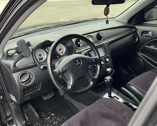 Чорний Міцубісі Аутлендер, об'ємом двигуна 2.38 л та пробігом 190 тис. км за 6800 $, фото 15 на Automoto.ua