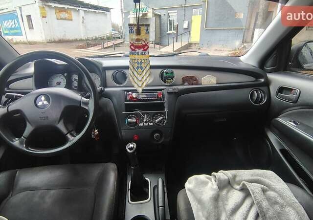 Черный Мицубиси Аутлендер, объемом двигателя 2 л и пробегом 330 тыс. км за 4997 $, фото 15 на Automoto.ua