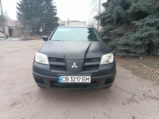Черный Мицубиси Аутлендер, объемом двигателя 2 л и пробегом 495 тыс. км за 4400 $, фото 7 на Automoto.ua