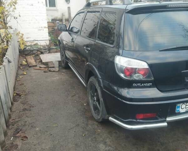 Черный Мицубиси Аутлендер, объемом двигателя 2.4 л и пробегом 280 тыс. км за 5455 $, фото 3 на Automoto.ua