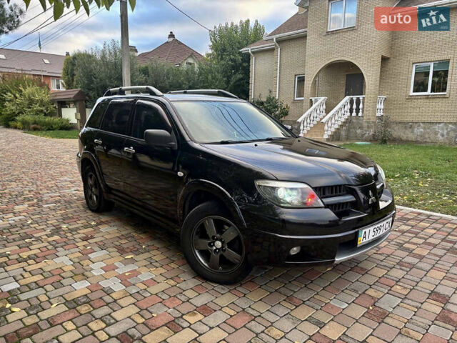 Чорний Міцубісі Аутлендер, об'ємом двигуна 2.38 л та пробігом 247 тис. км за 5499 $, фото 32 на Automoto.ua