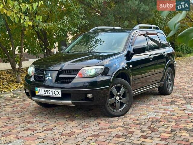 Чорний Міцубісі Аутлендер, об'ємом двигуна 2.38 л та пробігом 247 тис. км за 5499 $, фото 40 на Automoto.ua