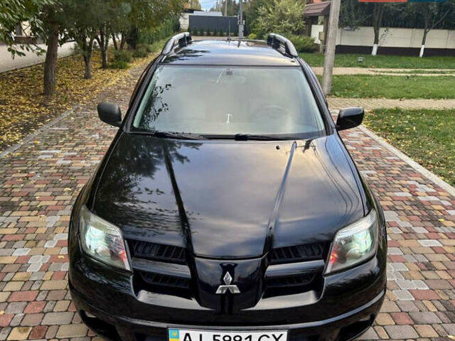 Чорний Міцубісі Аутлендер, об'ємом двигуна 2.38 л та пробігом 247 тис. км за 5499 $, фото 3 на Automoto.ua