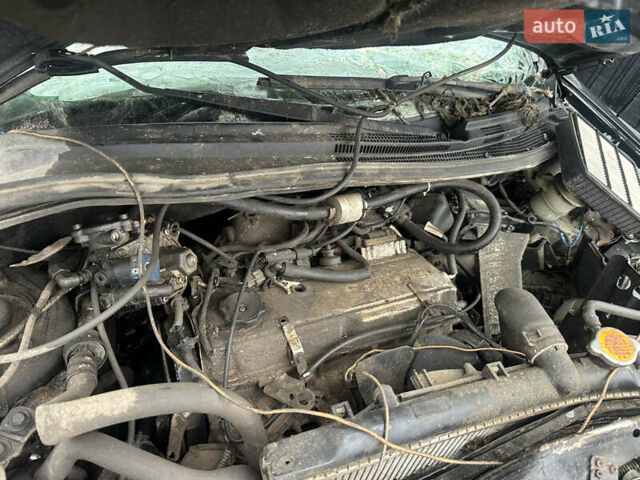 Черный Мицубиси Аутлендер, объемом двигателя 2.4 л и пробегом 240 тыс. км за 2200 $, фото 1 на Automoto.ua