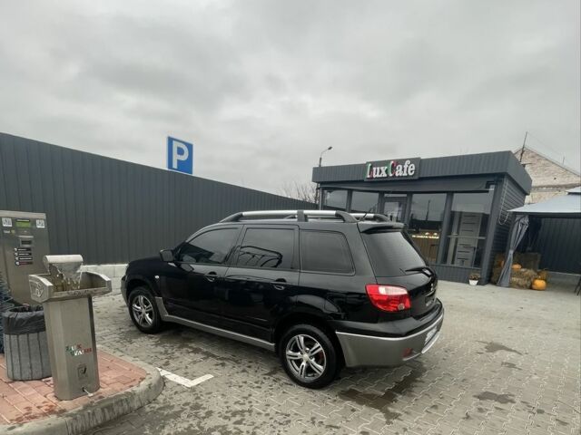 Черный Мицубиси Аутлендер, объемом двигателя 2 л и пробегом 297 тыс. км за 6500 $, фото 1 на Automoto.ua