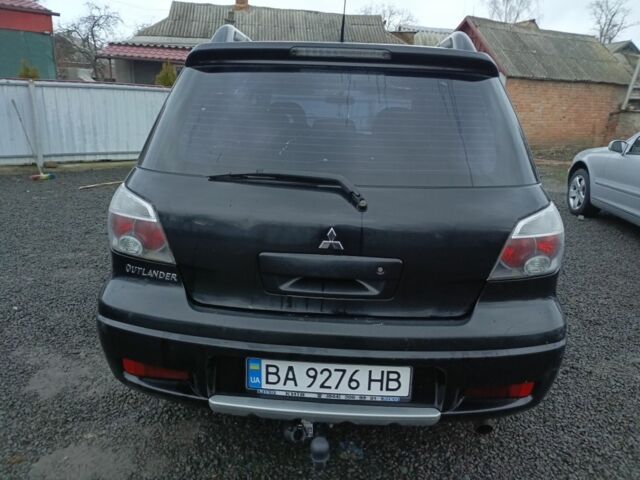 Черный Мицубиси Аутлендер, объемом двигателя 2 л и пробегом 200 тыс. км за 5100 $, фото 16 на Automoto.ua