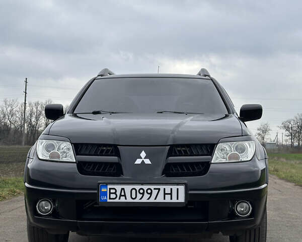 Черный Мицубиси Аутлендер, объемом двигателя 2 л и пробегом 230 тыс. км за 6300 $, фото 7 на Automoto.ua