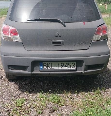 Чорний Міцубісі Аутлендер, об'ємом двигуна 2 л та пробігом 307 тис. км за 3000 $, фото 4 на Automoto.ua