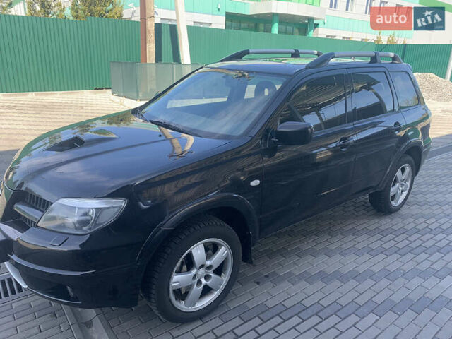 Черный Мицубиси Аутлендер, объемом двигателя 2 л и пробегом 212 тыс. км за 6000 $, фото 7 на Automoto.ua