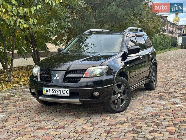 Чорний Міцубісі Аутлендер, об'ємом двигуна 2.38 л та пробігом 247 тис. км за 5499 $, фото 2 на Automoto.ua
