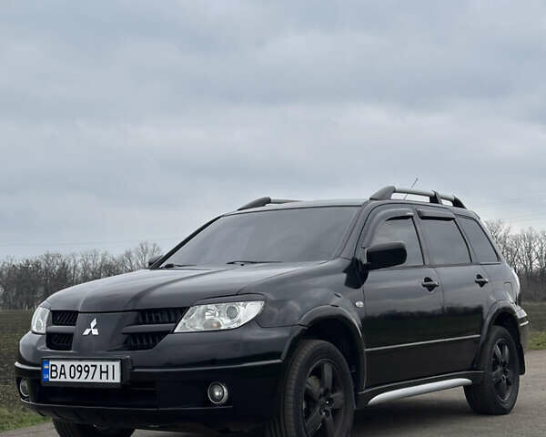 Черный Мицубиси Аутлендер, объемом двигателя 2 л и пробегом 230 тыс. км за 6300 $, фото 6 на Automoto.ua