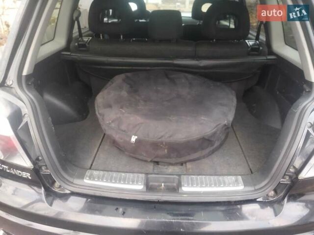 Черный Мицубиси Аутлендер, объемом двигателя 2.4 л и пробегом 280 тыс. км за 5455 $, фото 5 на Automoto.ua